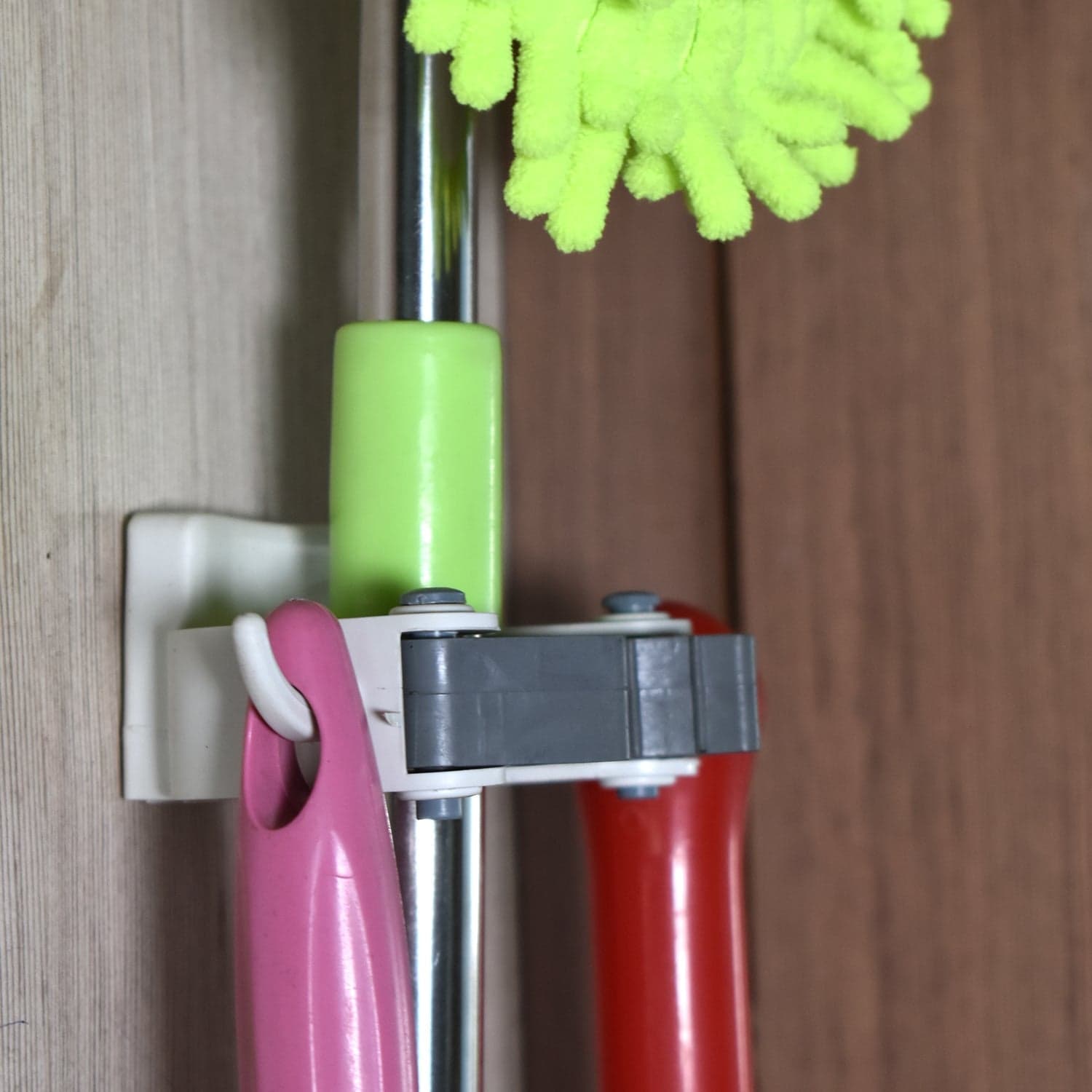 Invisible Mop Hanger used in all kinds of place like houses, offices, general stores for holding and hanging various mops and stuffs easily. thumbnail 6