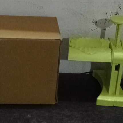 Dumpling press mold in brown box packaging