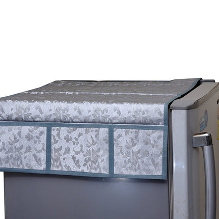 Decorative refrigerator top cover with assorted designs.