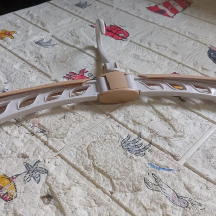 Compact travel clothes hanger with 360Â° rotation and adjustable features