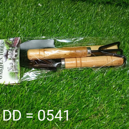Small garden tool set, hand cultivator, trowel, and fork, ideal for planting and garden care.